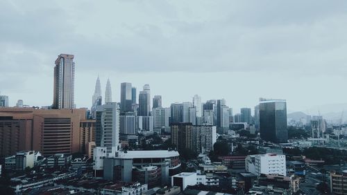 Modern buildings in city against sky