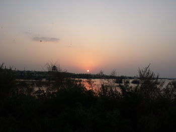 Scenic view of silhouette landscape against sky during sunset