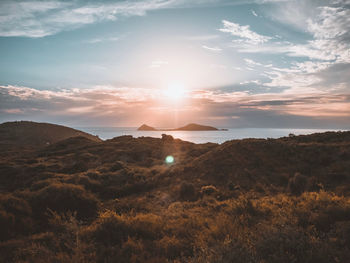 Scenic view of landscape against sky during sunset