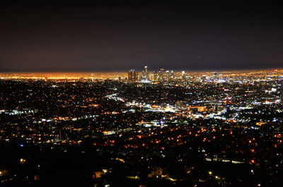 Aerial view of illuminated cityscape at night