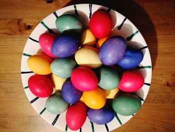 High angle view of multi colored eggs on table