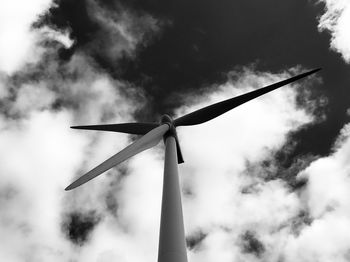 Low angle view of windmill against sky