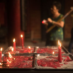 Lit candles in temple