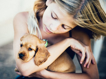 Teenage girl with puppy