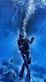 Person scuba diving in sea