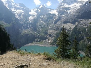 Scenic view of lake and mountains against sky