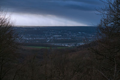 Scenic view of land against sky at dusk