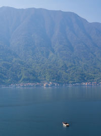 Scenic view of sea against mountain at lago di como in italy