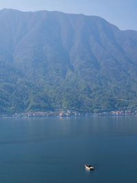 Scenic view of sea against mountain