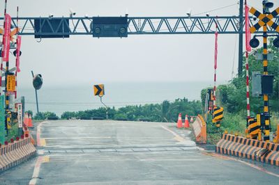 View of road leading towards sea against sky