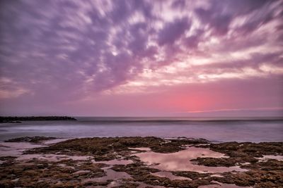 Scenic view of sea against sky at sunset