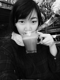 Close-up portrait of a girl drinking coffee