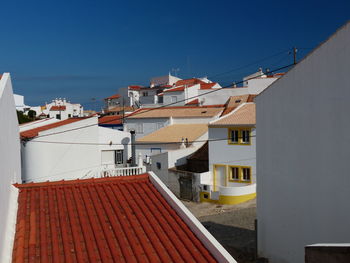 Buildings in mediterranean city against clear blue sky