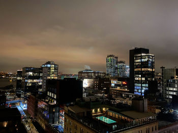 High angle view of illuminated buildings against sky at dusk rooftop 