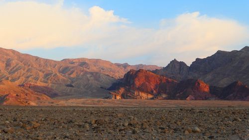 Scenic view of desert and mountains at sunrise 