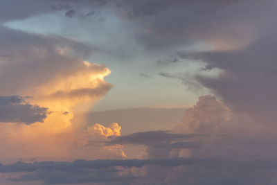 Formation of cumulus clouds formed by pink and orange clouds at dusk. 