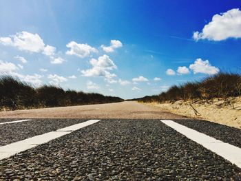 Empty road against sky