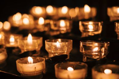 Close-up of lit tea lights