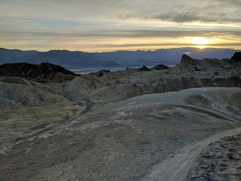 Scenic view of mountains against sky during sunset