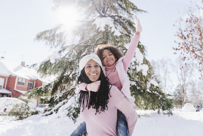 Portrait of smiling woman in snow