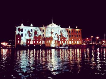 Illuminated buildings in city at night