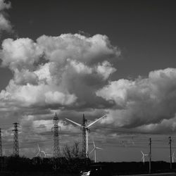 Low angle view of electricity pylon against sky