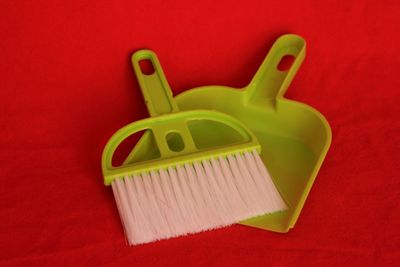 High angle view of brush with dustpan
