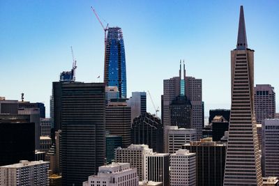 Skyscrapers in city against clear sky