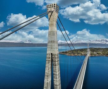 Bridge over sea against sky