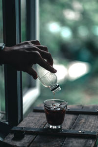 Close-up of hand holding drink