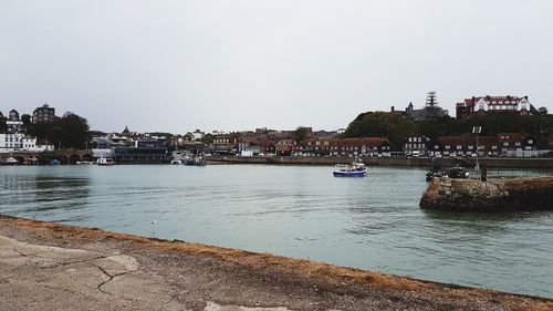 Boats moored at harbor