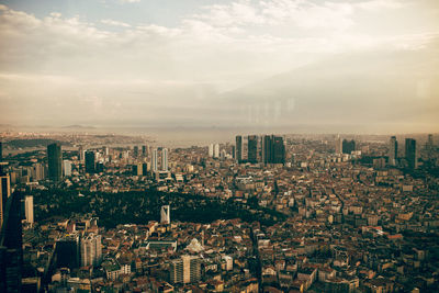 Aerial view of modern buildings in istanbul, turkey against sky