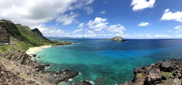 Panoramic view of bay against sky