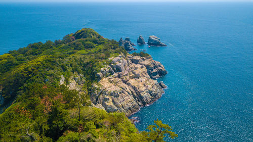 High angle view of rocks by sea