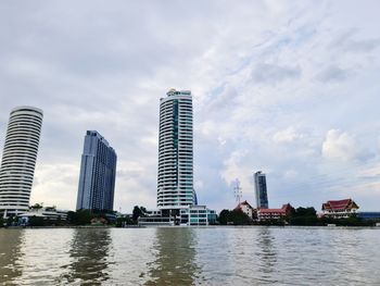 Modern buildings in city against sky