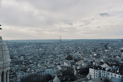 High angle view of city against cloudy sky