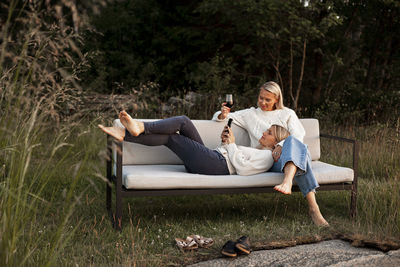 Female friends sitting on bench