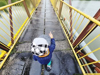 High angle view of man working on railing