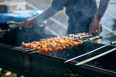 Cropped hand of man preparing food