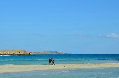 Scenic view of sea against blue sky
