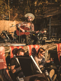 People playing guitar at nightclub