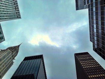 Low angle view of building against cloudy sky