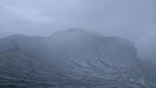 Scenic view of mountains against sky during winter