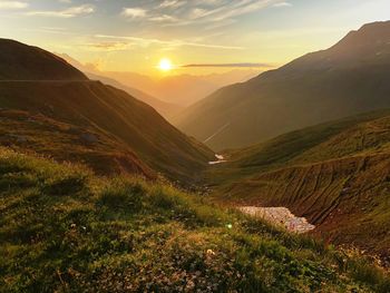 Scenic view of landscape against sky during sunset