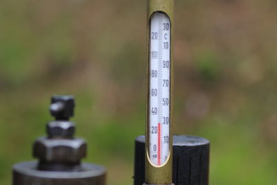 Close-up of thermometer in factory