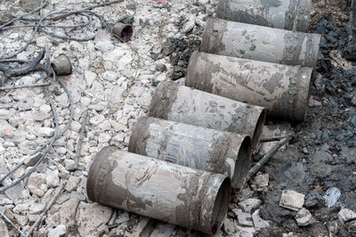 Stack of garbage by stone wall