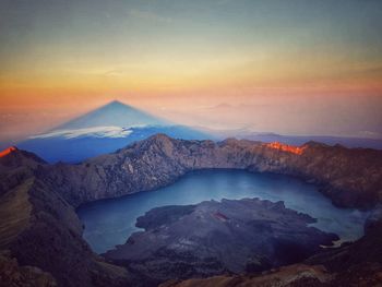 Scenic view of mountain range against sky during sunset