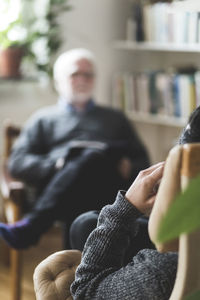 Man with therapist in home office