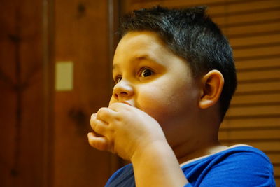 Portrait of cute boy looking away