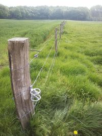 Wooden fence on field